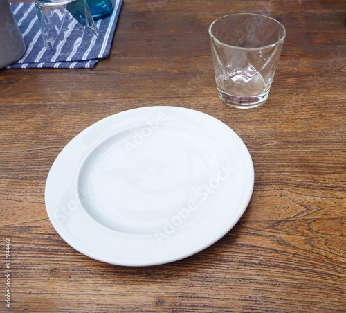 white plate prepared on a wooden table