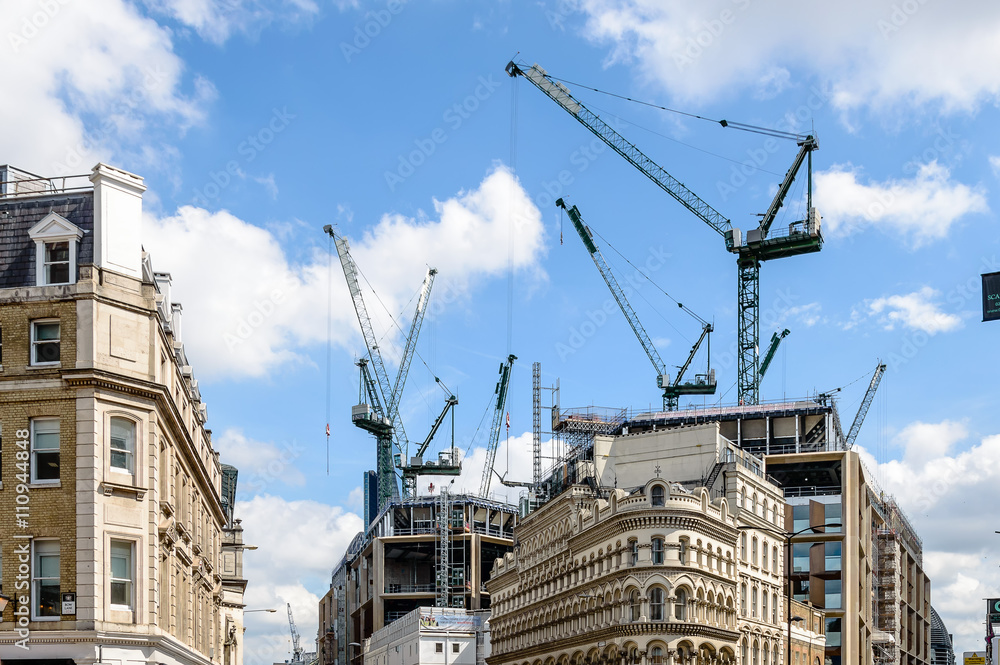 Cranes on a building under construction Cranes on a building under construction