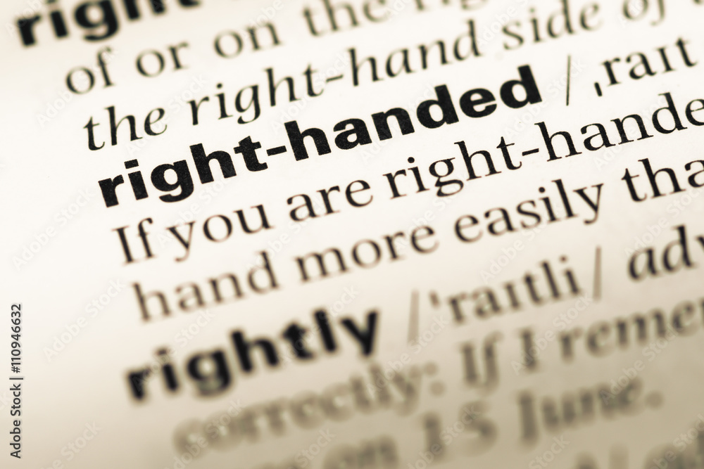 Close up of old English dictionary page with word right handed Close up of old English dictionary page with word right handed