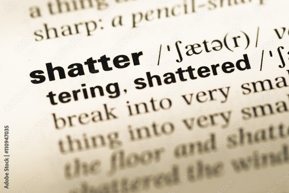 Close up of old English dictionary page with word shatter Close up of old English dictionary page with word shatter