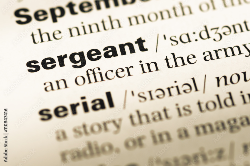 Close up of old English dictionary page with word sergeant Close up of old English dictionary page with word sergeant