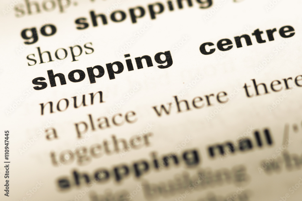 Close up of old English dictionary page with word shopping centr Close up of old English dictionary page with word shopping centr