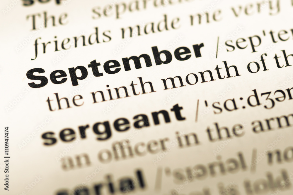 Close up of old English dictionary page with word september Close up of old English dictionary page with word september