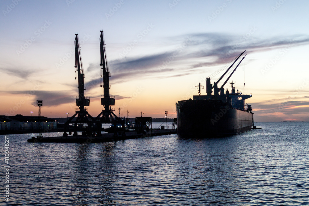 Silhouettes of ship and cranes in a port of Santarem city, Brazil