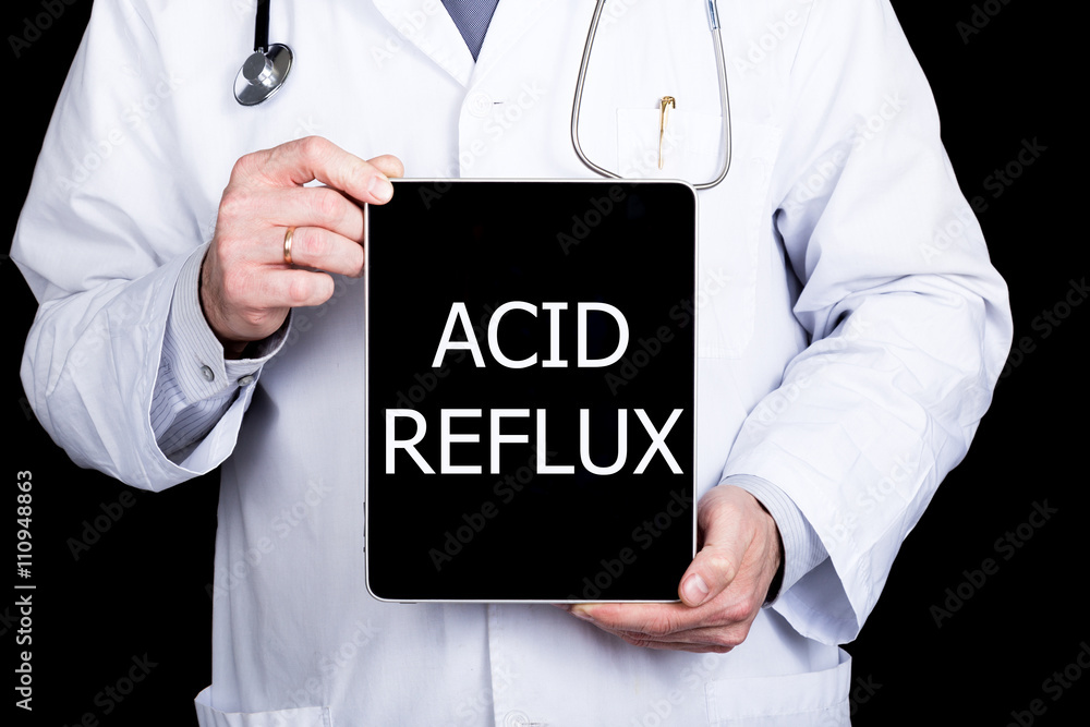 technology, internet and networking in medicine concept - Doctor holding a tablet pc with acid reflux sign. Internet technologies in medicine technology, internet and networking in medicine concept - Doctor holding a tablet pc with acid reflux sign. Internet technologies in medicine