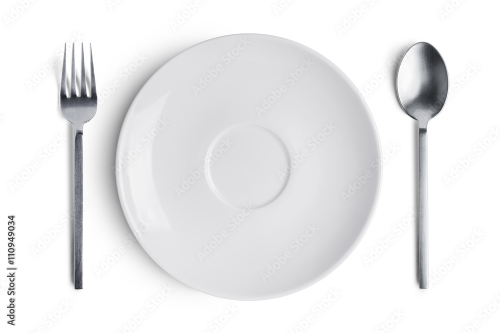 A white plate with silver fork and spoon A white plate with silver fork and spoon