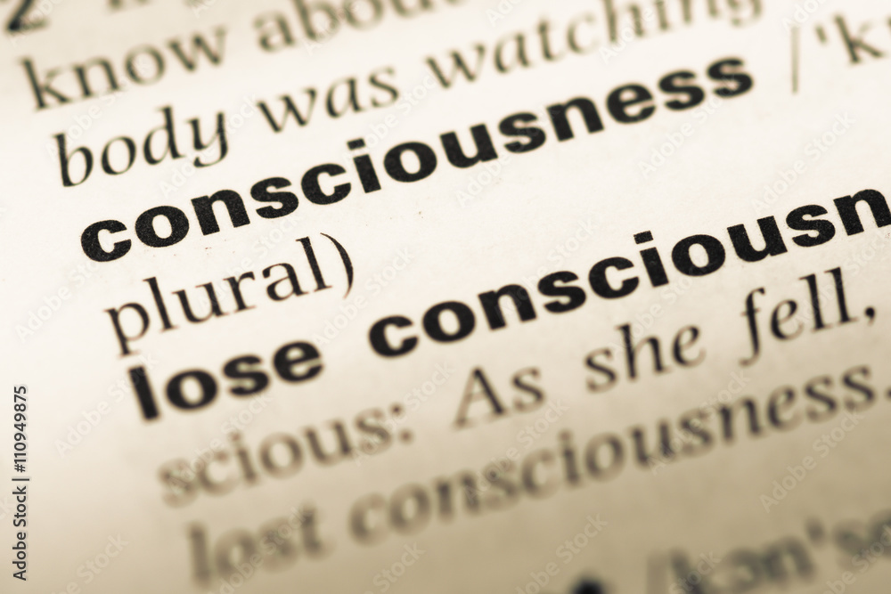 Close up of old English dictionary page with word consciousness Close up of old English dictionary page with word consciousness