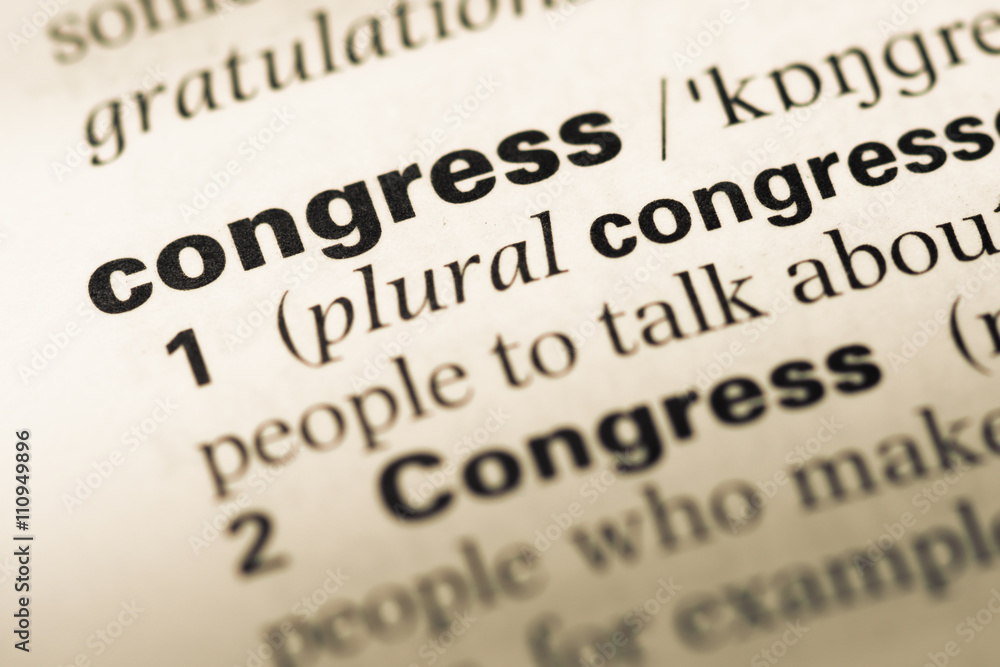 Close up of old English dictionary page with word congress Close up of old English dictionary page with word congress