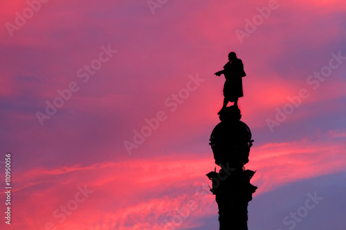 silhouette of the Monument of Columbus at pink sunset in Barcelona