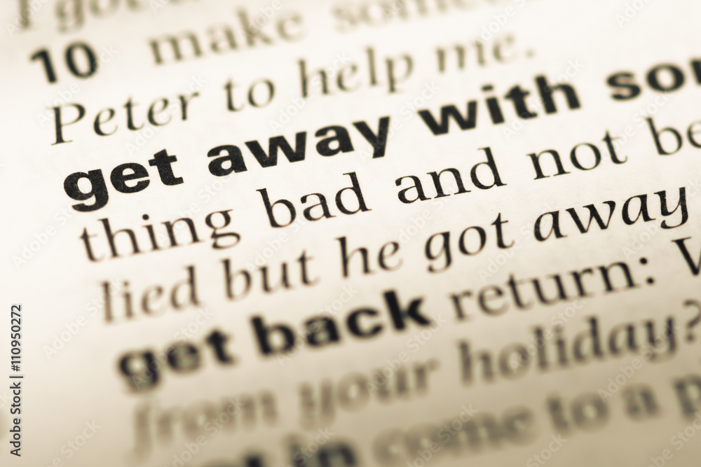 Close up of old English dictionary page with word get away with Close up of old English dictionary page with word get away with