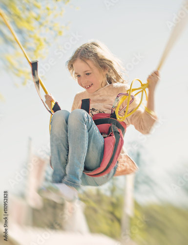Photography Little girl on bungee trampoline with cords.