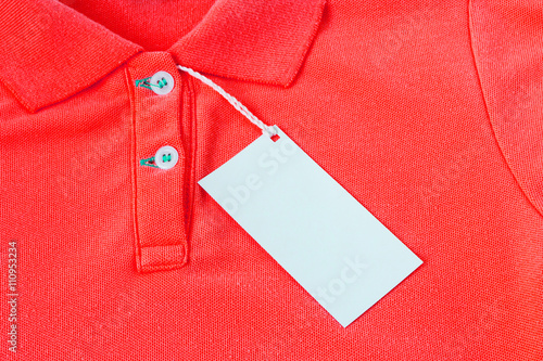 a blank white label or tag attached on shirt