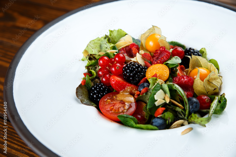 Summer salad with nut mass and seasonal berries selected focus