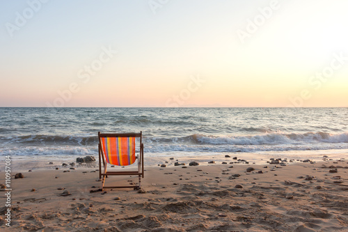 Beach chair with sunset © Pheniti