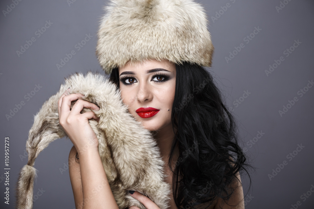 Fur Fashion. Beautiful Girl in Fur Hat. Winter Woman Portrait Fur Fashion. Beautiful Girl in Fur Hat. Winter Woman Portrait