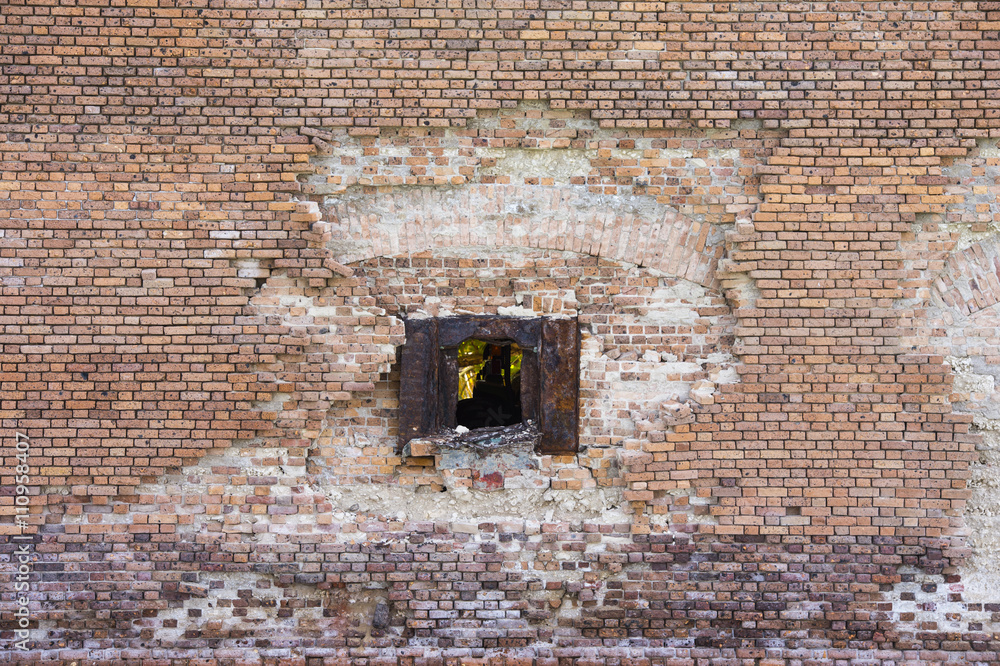 Naklejka premium brick wall with small opening