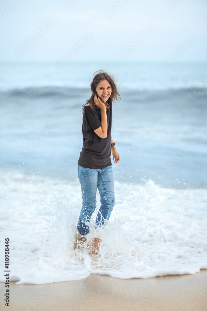 happy beautiful woman enjoying the waves on the tropical sea happy beautiful woman enjoying the waves on the tropical sea