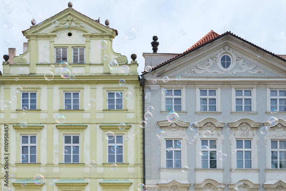 soap bubbles on the background of old houses in Prague