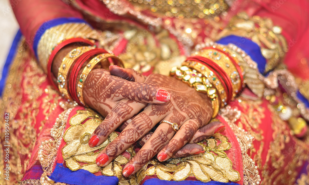 Bridal henna covered hands of an Indian Bride