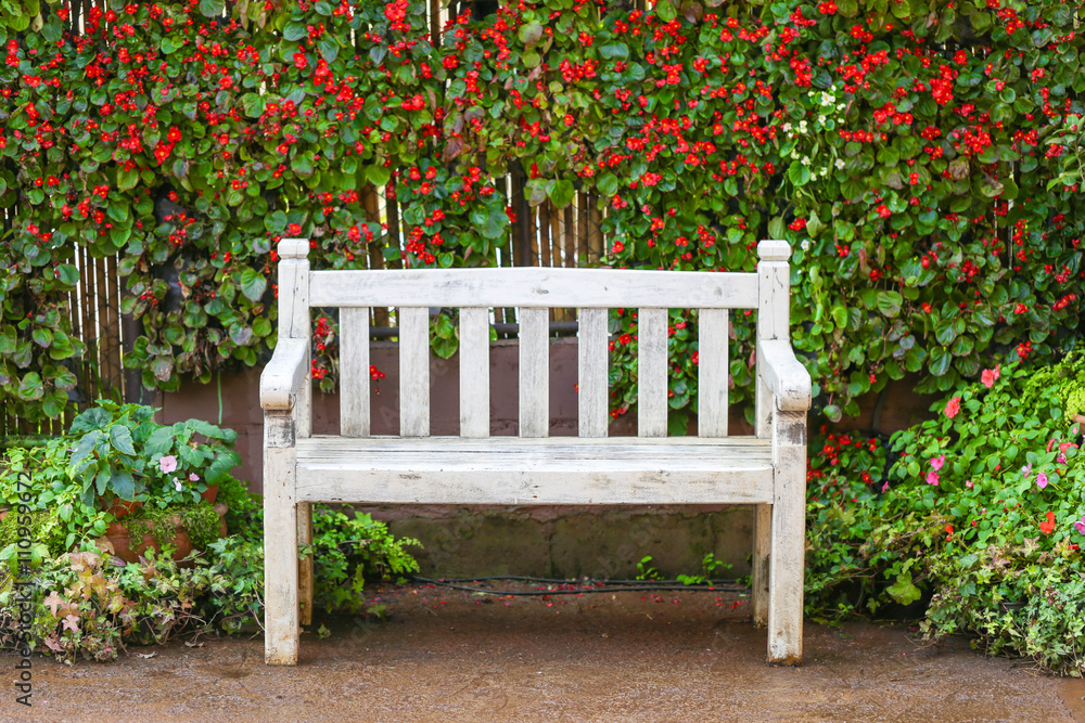 White bench with flower background, selective focus White bench with flower background, selective focus