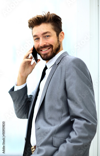 businessman speaking on the phone in office