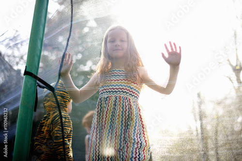 Girl in garden trampoline