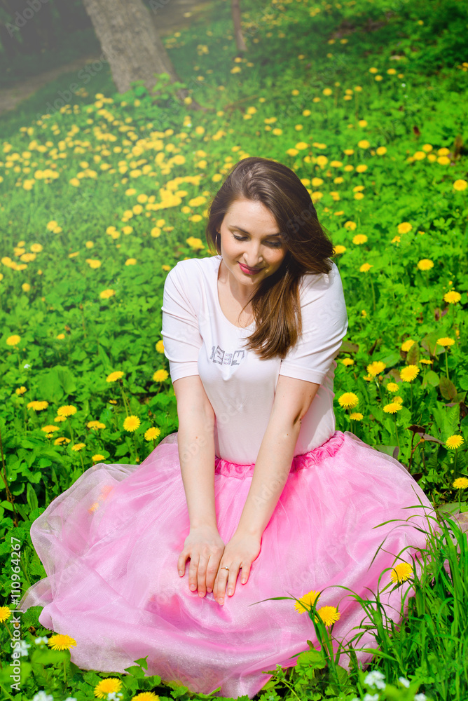 Beautiful sexy young hipster girl outdoors.Posh woman with long brunette hair evening makeup wearing light fluffy pink rosy skirt and vans sneakers posing outdoors in the city urban style in summer Beautiful sexy young hipster girl outdoors.Posh woman with long brunette hair evening makeup wearing light fluffy pink rosy skirt and vans sneakers posing outdoors in the city urban style in summer
