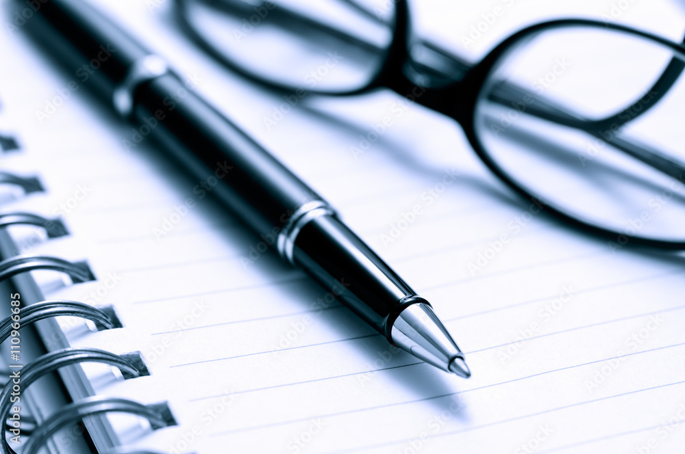 Pen, Glasses, and Lined Notebook Paper Pen, Glasses, and Lined Notebook Paper
