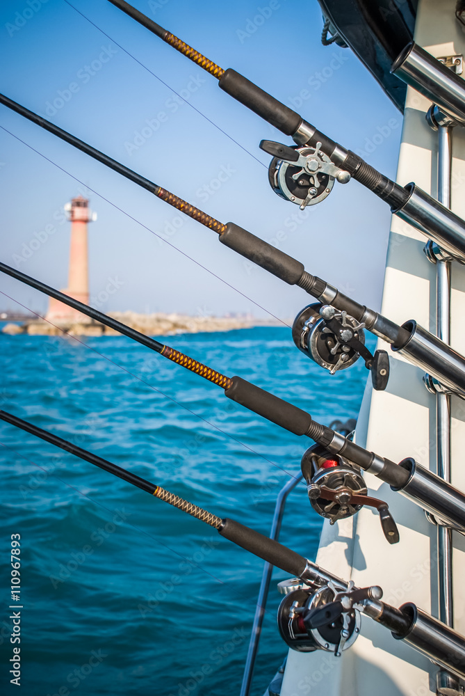 Four Fishing Poles on a Charter Boat Four Fishing Poles on a Charter Boat