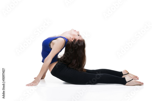 ?oung beautiful caucasian woman in yoga pose in studio isolated on white background