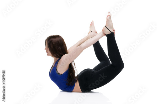 ?oung beautiful caucasian woman in yoga pose in studio isolated on white background