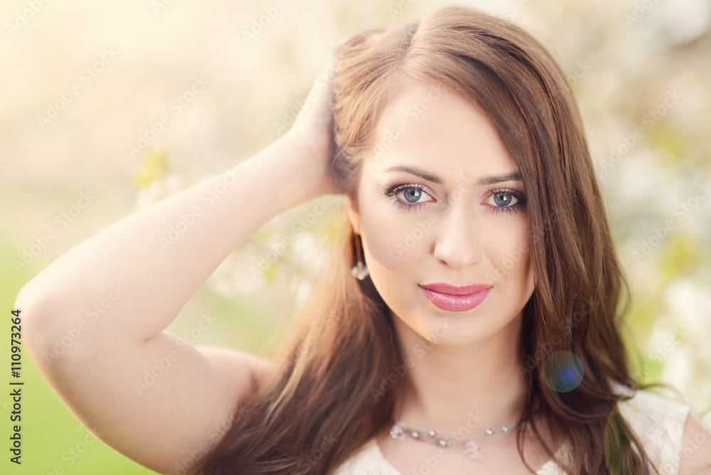 Spring portrait of beautiful young brunette