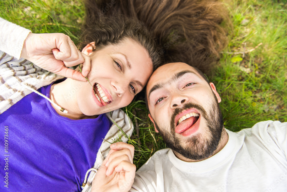 ? Handsome man with beard and young pretty cheerful girl with glasses making selfie. ? Handsome man with beard and young pretty cheerful girl with glasses making selfie.