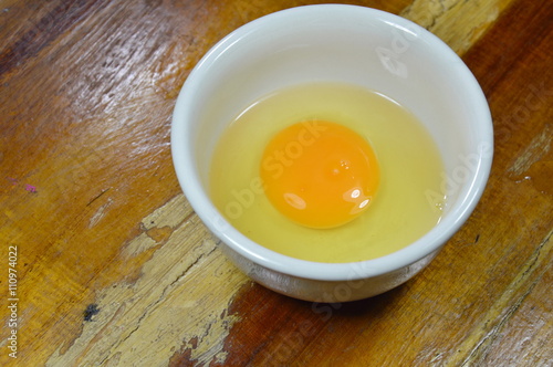 egg yolk in cup on table