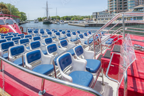 Empty chairs on a sightseeing boat © Dan Kosmayer
