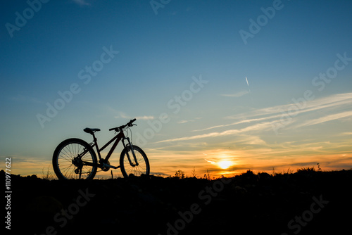 Bike at sunset on a field