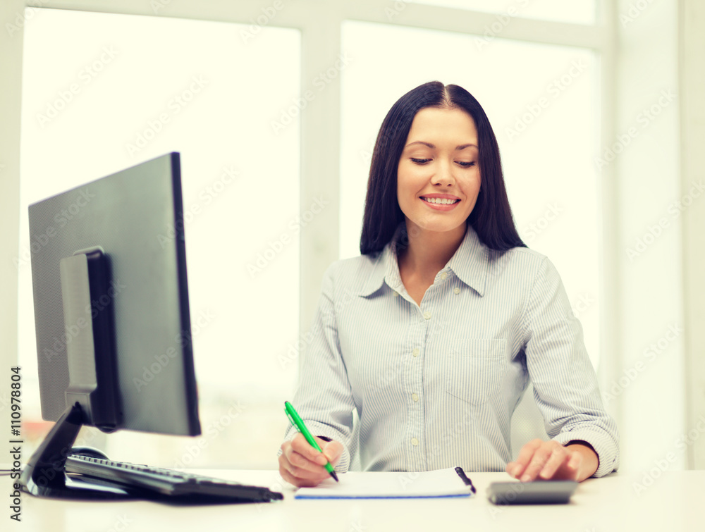 woman with computer, notebook and calculator woman with computer, notebook and calculator