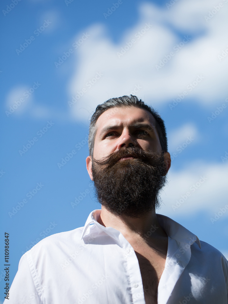 Fototapeta premium Bearded man on blue sky