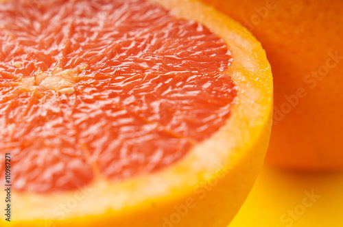 Blood oranges on yellow background