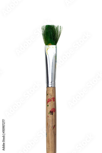 cropped image of a stained paintbrush.