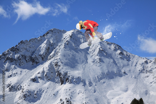 Photography Snowboard rider jumping on mountains