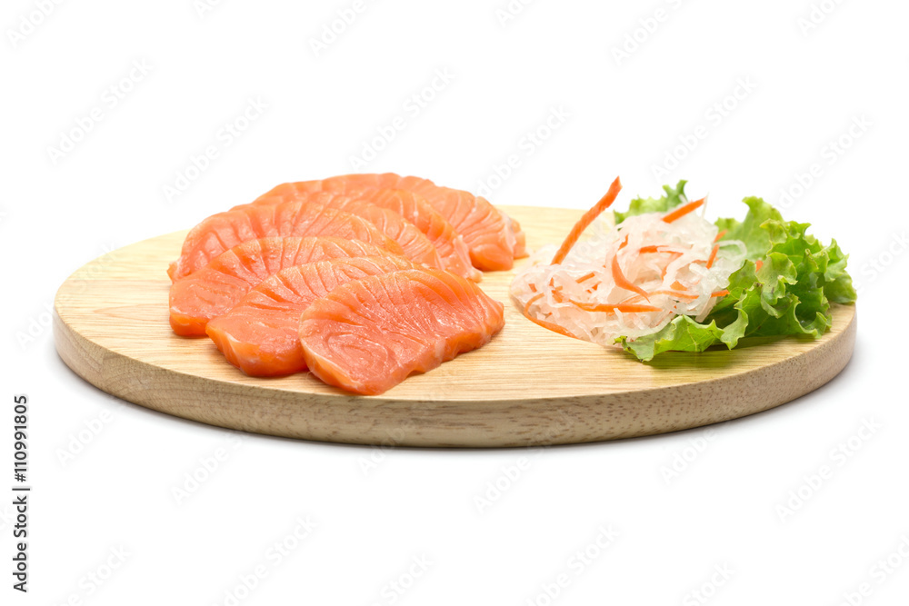 Sliced salmon on wood background