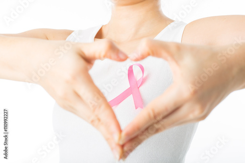 Pink Breast cancer awareness ribbon holding by woman