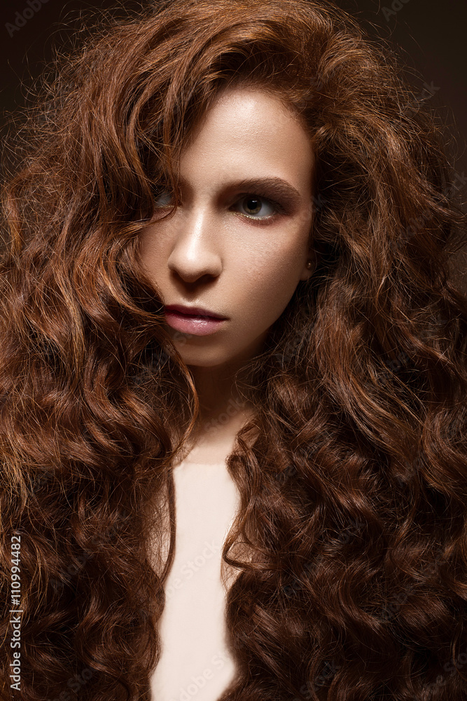 Beautiful redhead girl with curls and classic make-up. Beauty face. Beautiful redhead girl with curls and classic make-up. Beauty face.