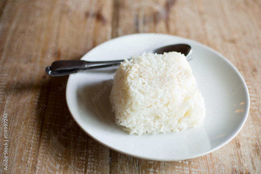 White rice jamince on the wood table. White rice jamince on the wood table.