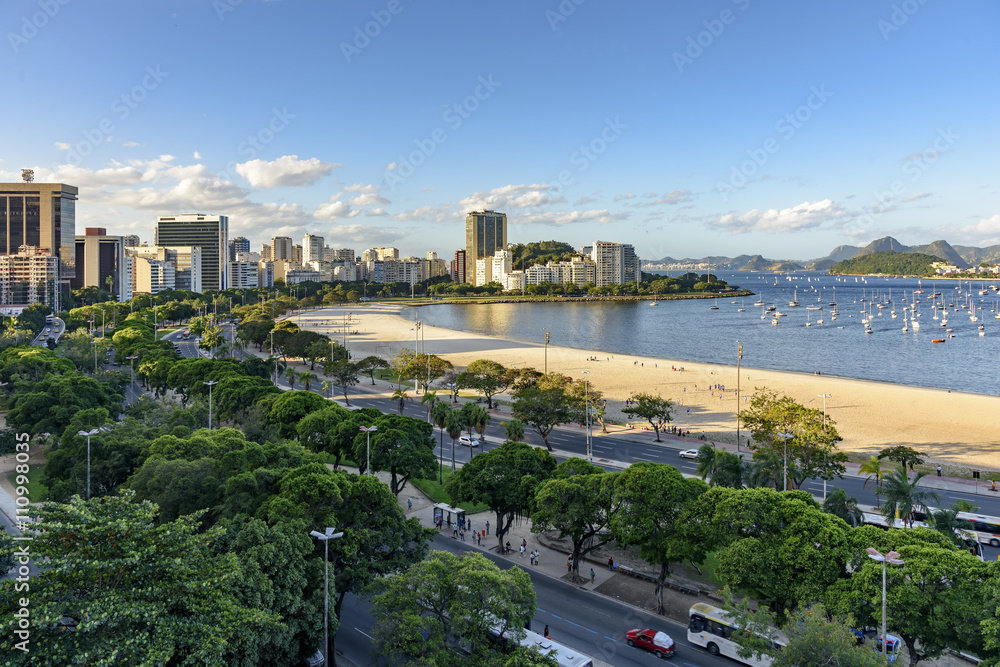 Fototapeta premium Beach and cove of Botafogo at Rio de Janeiro and its buildings cars and boats