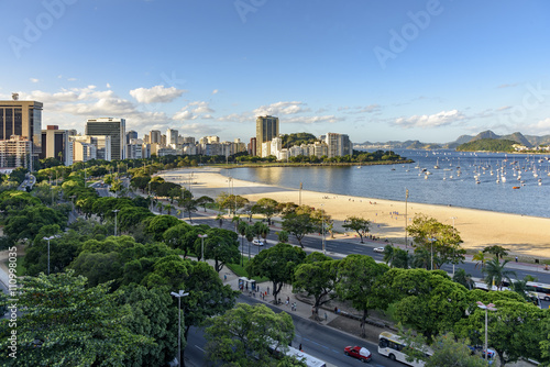 Beach and cove of Botafogo at Rio de Janeiro and its buildings cars and boats photo