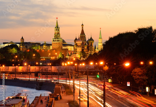 View of Kremlin towers, Saint Basils Cathedral and city highway at night, Moscow, Russia