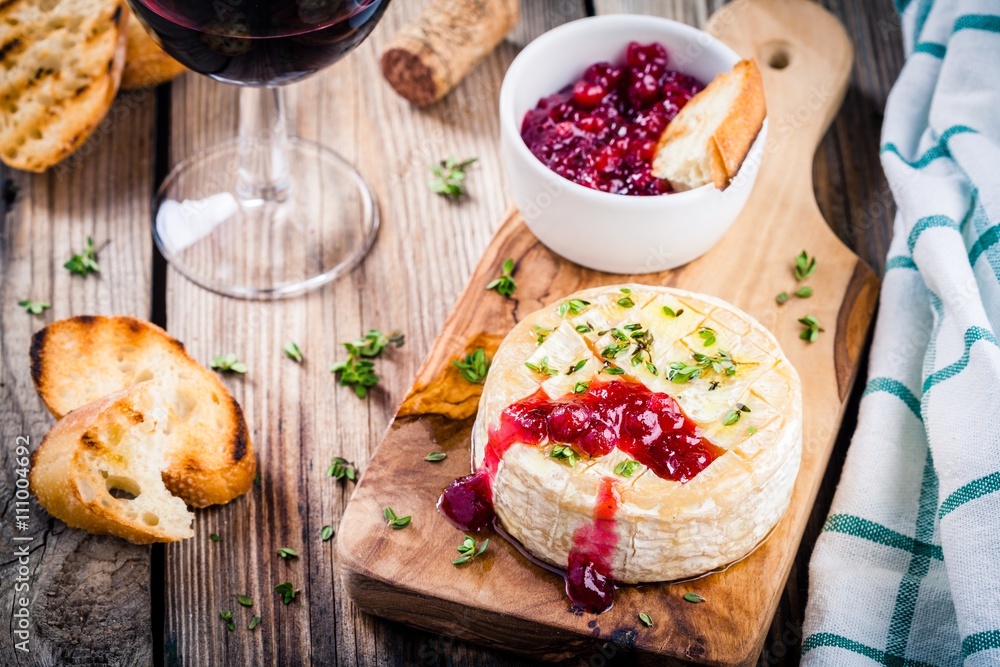 Baked camembert with cranberry sauce and thyme Baked camembert with cranberry sauce and thyme