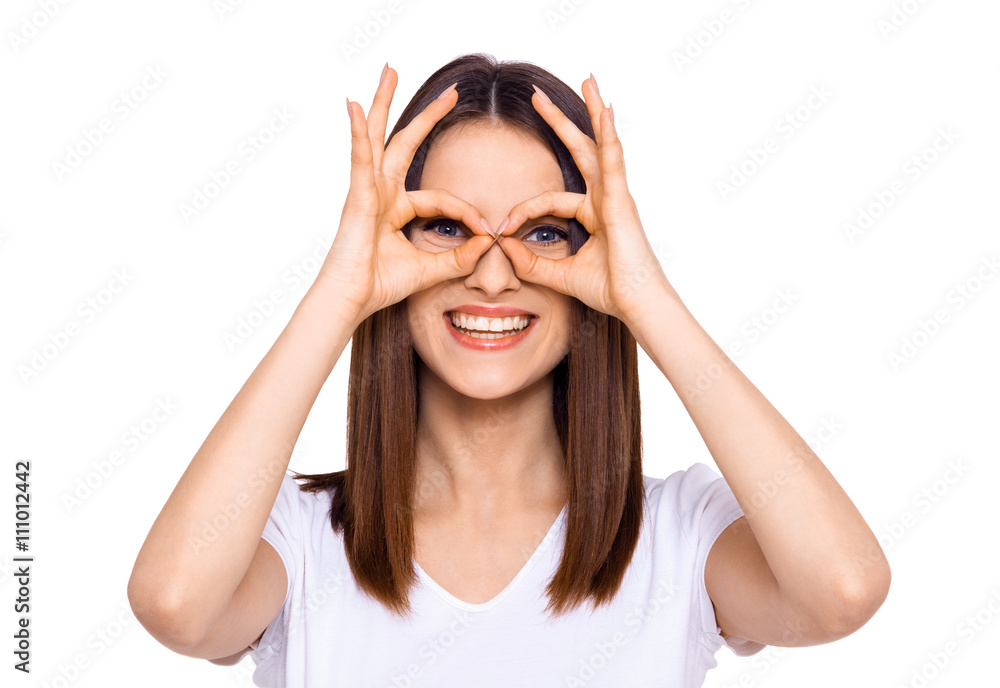 Making a face. Cheerful young woman making a face and gesturing while standing isolated on white Making a face. Cheerful young woman making a face and gesturing while standing isolated on white